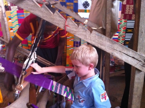 Trying his hand at weaving kente